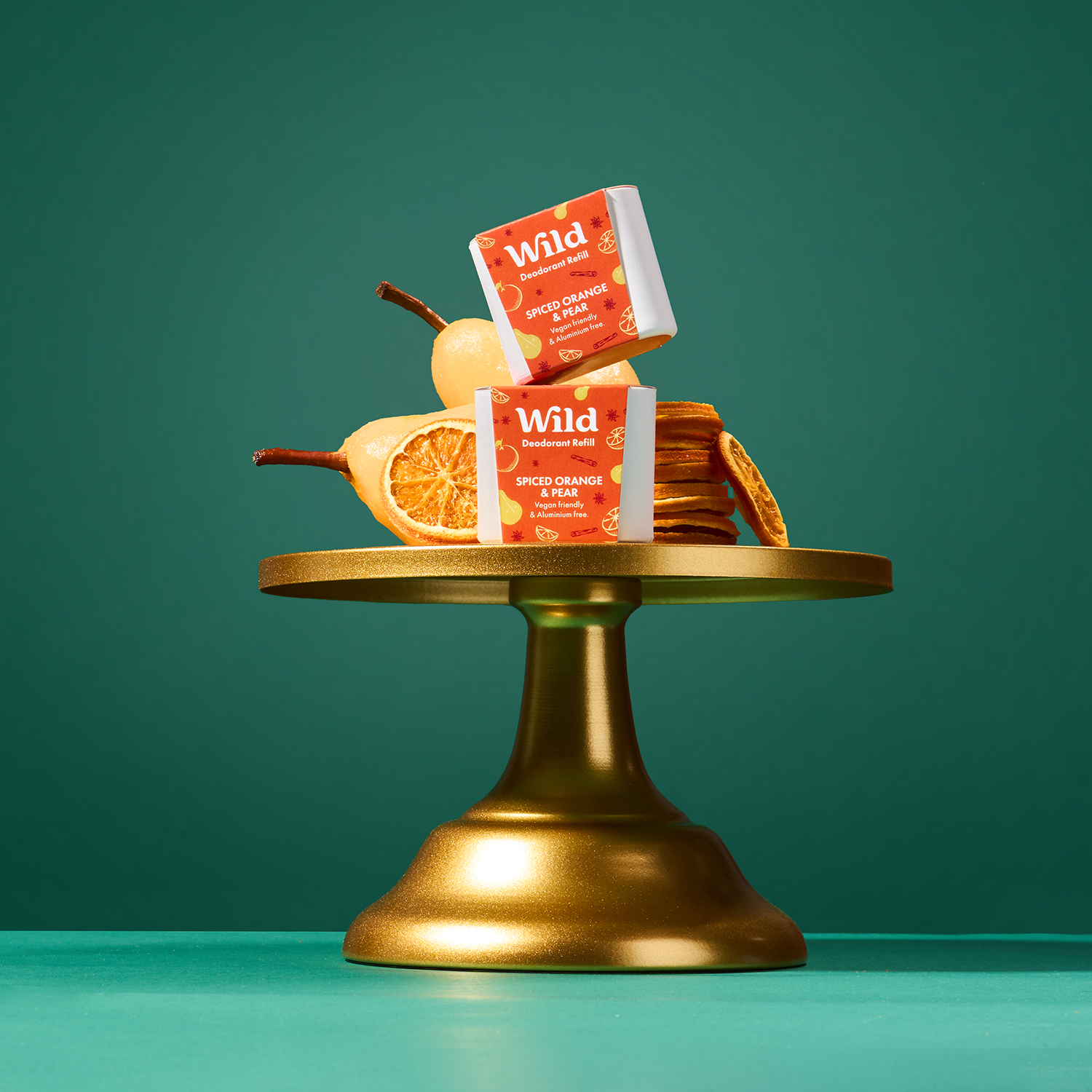 Caption: a gold plate topped with fruit and a bar of soap