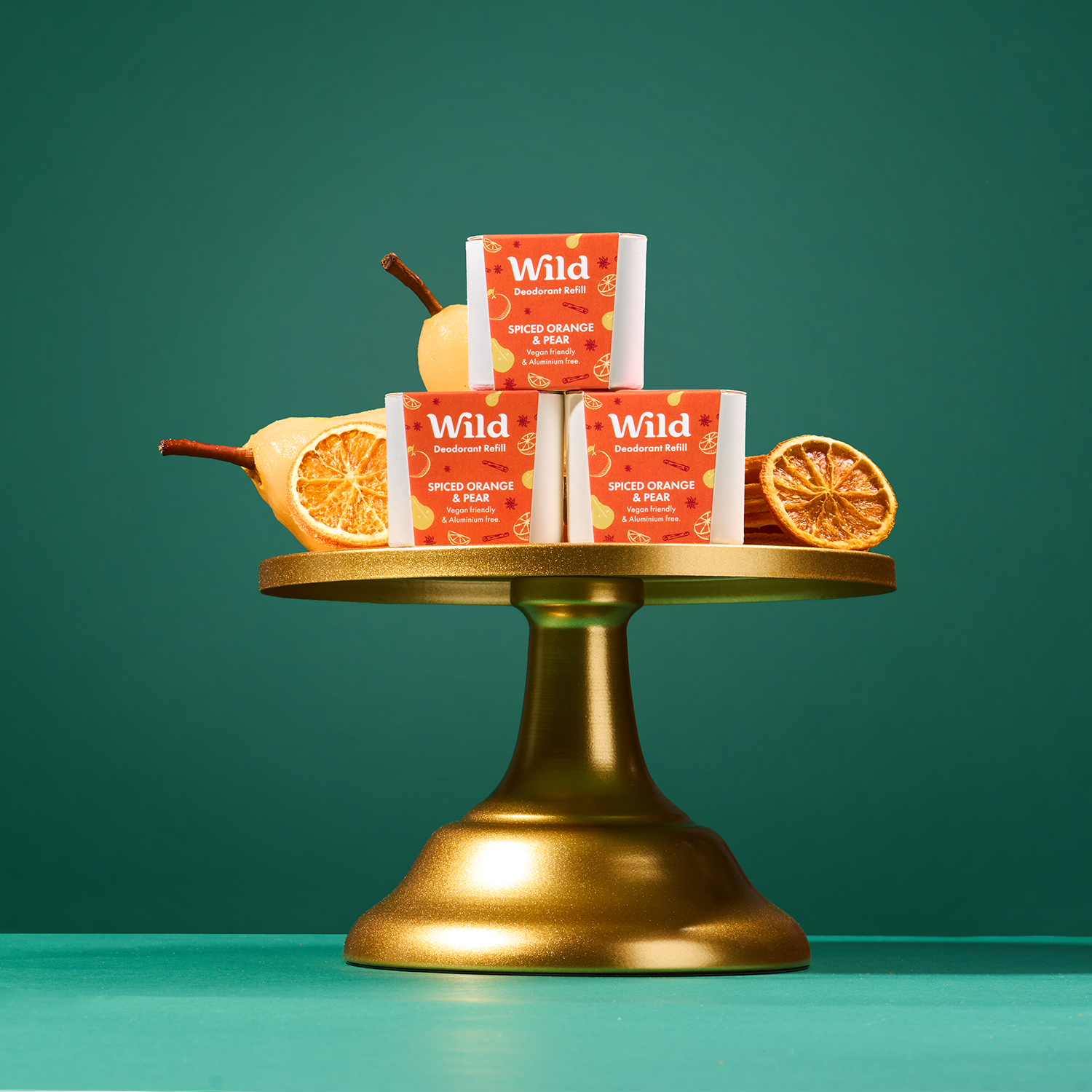 Caption: a gold tray with oranges and bars of soap on it