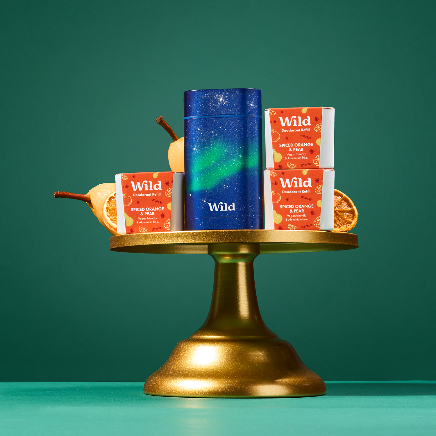 Caption: a gold candle holder with three different types of candles on it