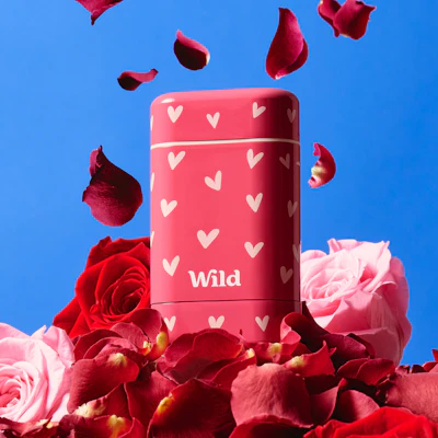 Caption: a close up of a pink container surrounded by flowers