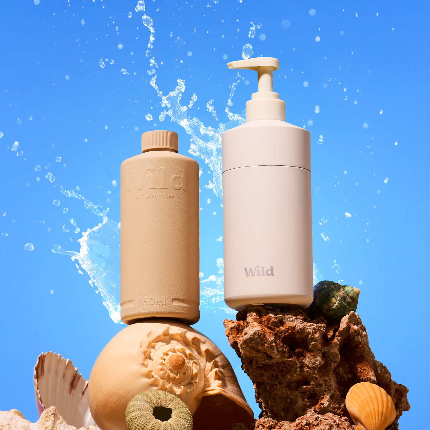 Caption: a bottle of lotion sitting next to a soap dispenser