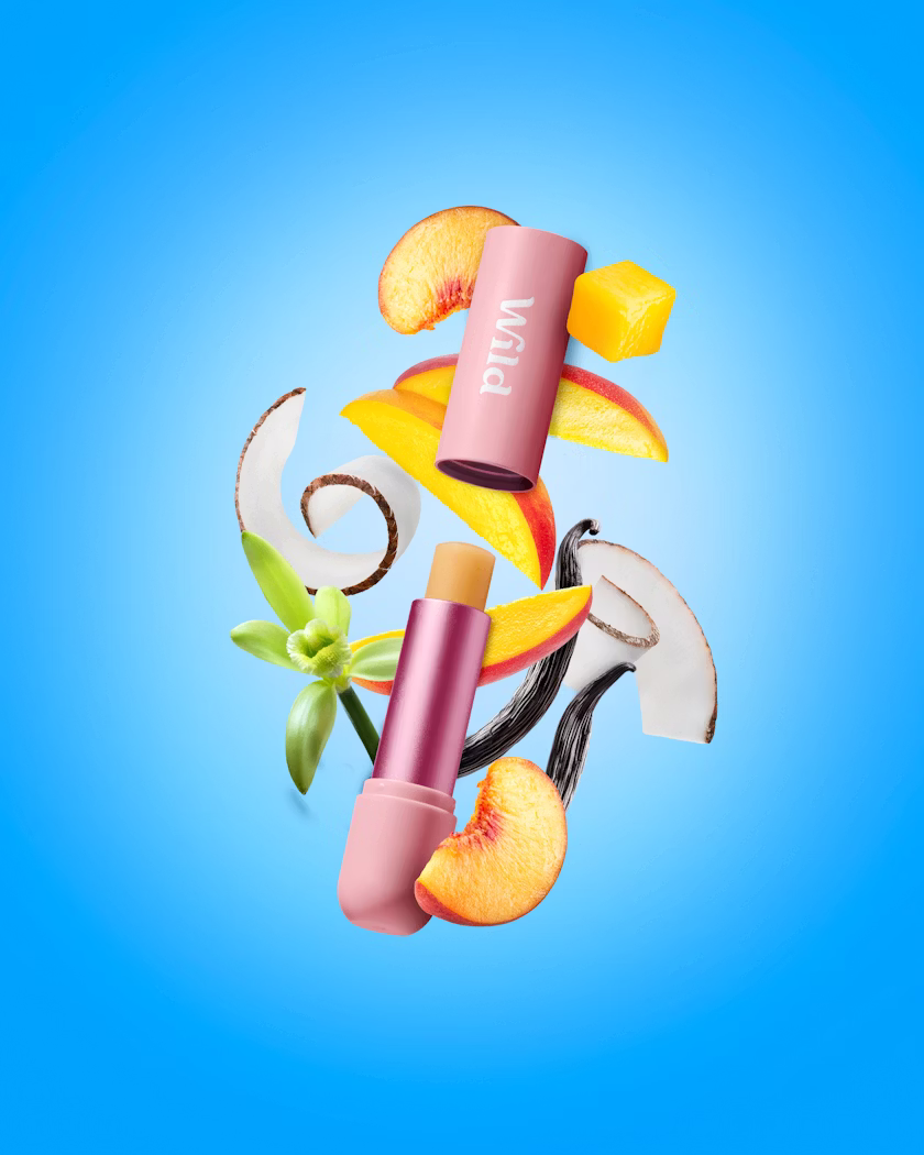 Caption: a blue background with a lipstick, scissors, and fruit
