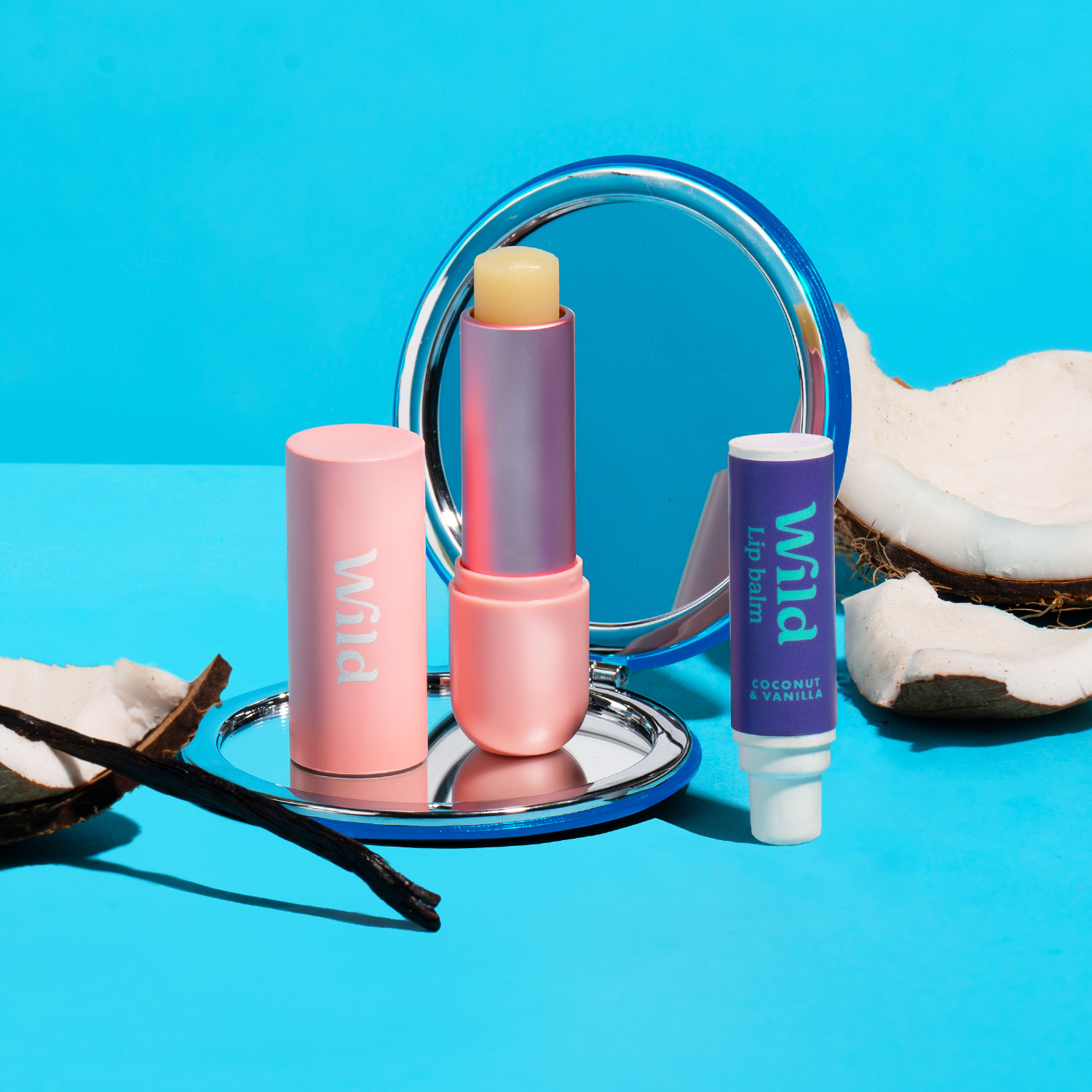 Caption: a blue table topped with a mirror and lipstick