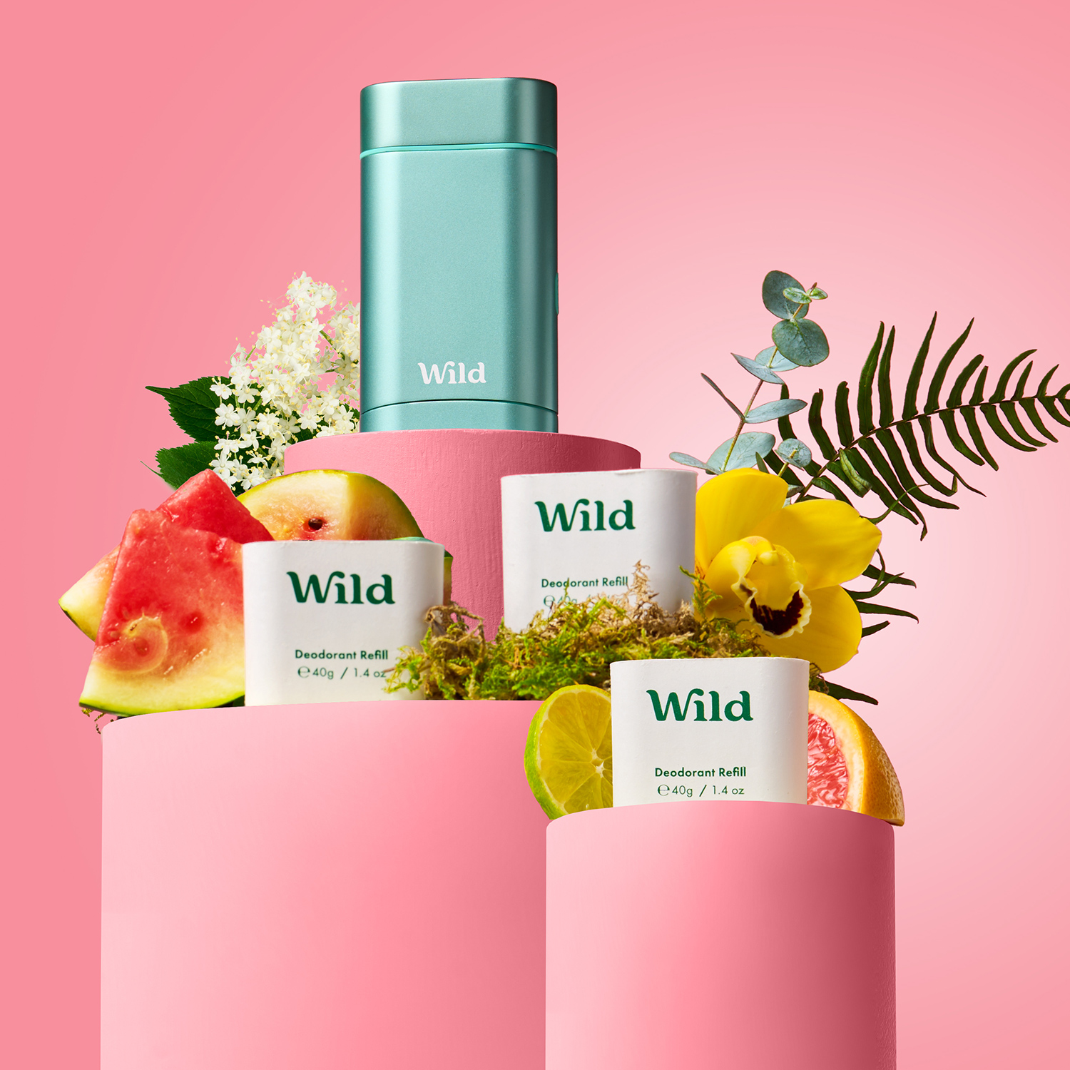 Caption: a bottle of wild is surrounded by fruit and flowers
