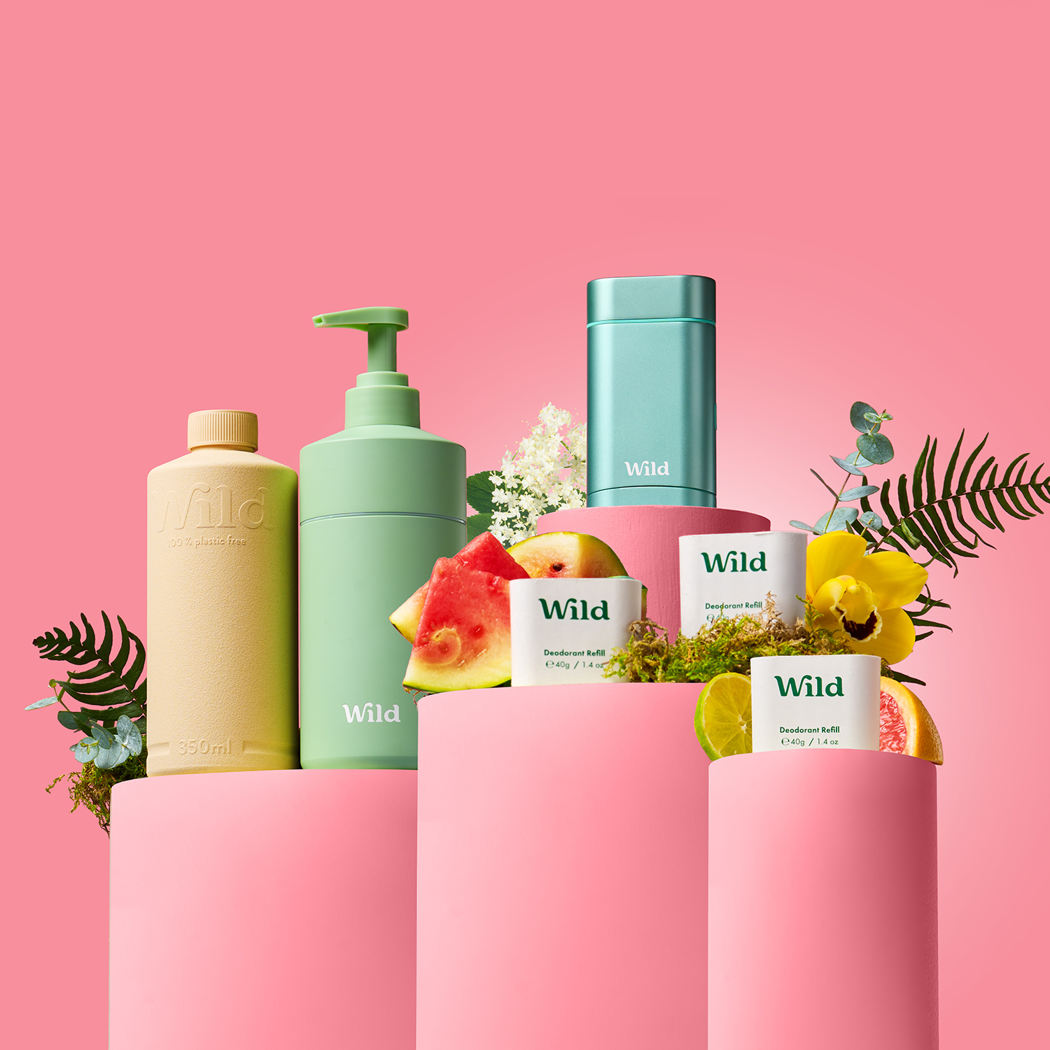 Caption: a pink background with a lot of different types of skin care products