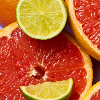 Caption: a close up of a grapefruit, lime, and oranges