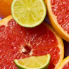 Caption: a close up of a grapefruit, lime, and oranges