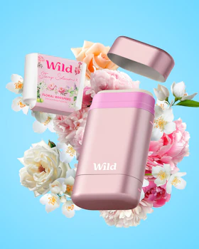 Caption: a couple of pink containers sitting on top of a bouquet of flowers