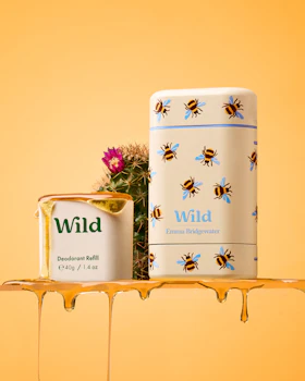 Caption: a can of wild honey next to a can of honey