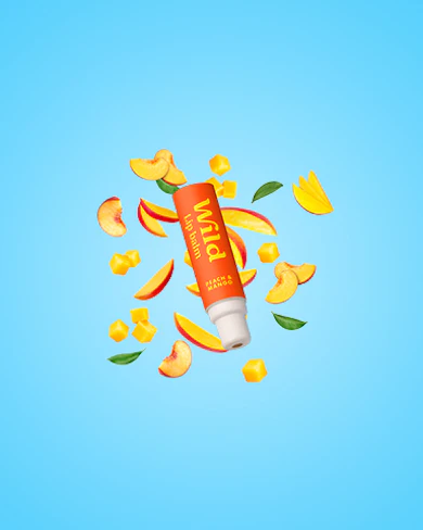 Caption: a tube of toothpaste surrounded by orange peels