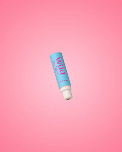 Caption: a tube of lip balm on a pink background