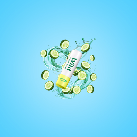Caption: a tube of toothpaste surrounded by sliced cucumbers
