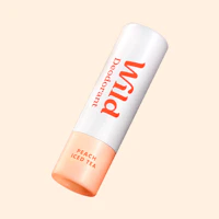 Caption: a tube of lip balm on a beige background