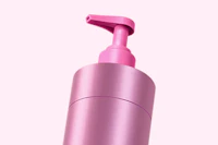 Caption: a pink bottle of lotion on a white background