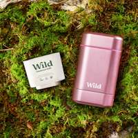 Caption: a pink lighter next to a box of wild