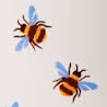 Caption: a group of three bees flying through the air