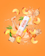 Caption: a tube of vitamin water surrounded by fruit