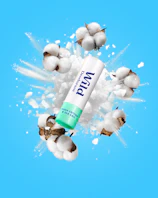 Caption: a bottle of whey sitting on top of a pile of cotton