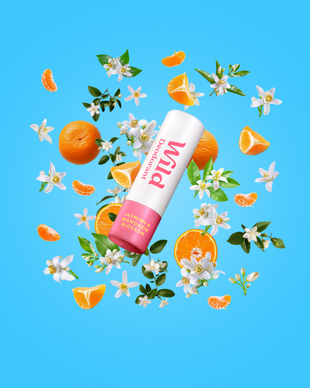 Caption: a tube of lip balm surrounded by oranges and flowers