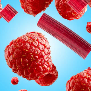 Caption: a bunch of raspberries flying through the air