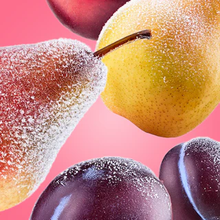 Caption: a close up of plums and an apple on a pink background