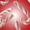 Caption: a red and white candy cane pattern on a red background