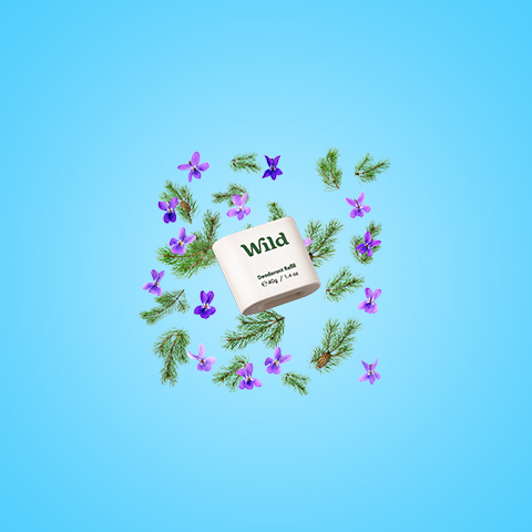 Bildunterschrift: ein Papier mit dem Wort "wild", umgeben von lila Blumen