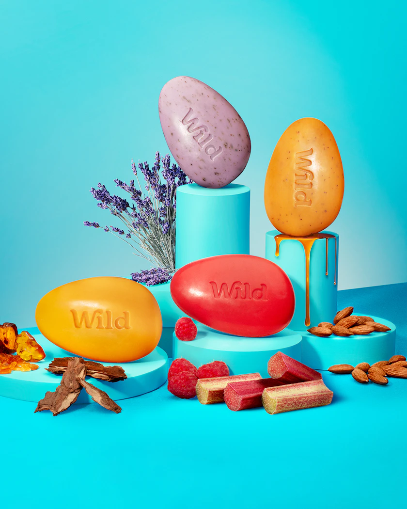 Caption: a group of soaps sitting on top of a blue table