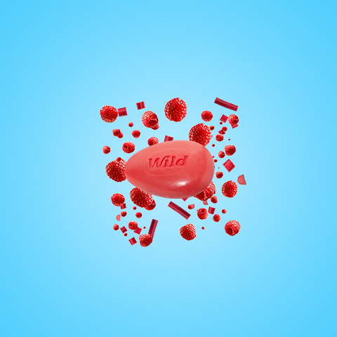 Légende : une pilule rouge entourée d'objets rouges