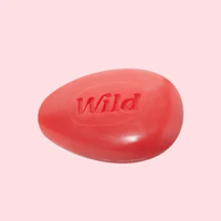 Caption: a red soap bar with the word wild written on it