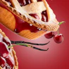Caption: a piece of pie with cherries on top of it
