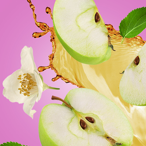 Légende : une pomme coupée en deux avec une fleur sur fond rose