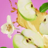 Caption: an apple cut in half with a flower on a pink background