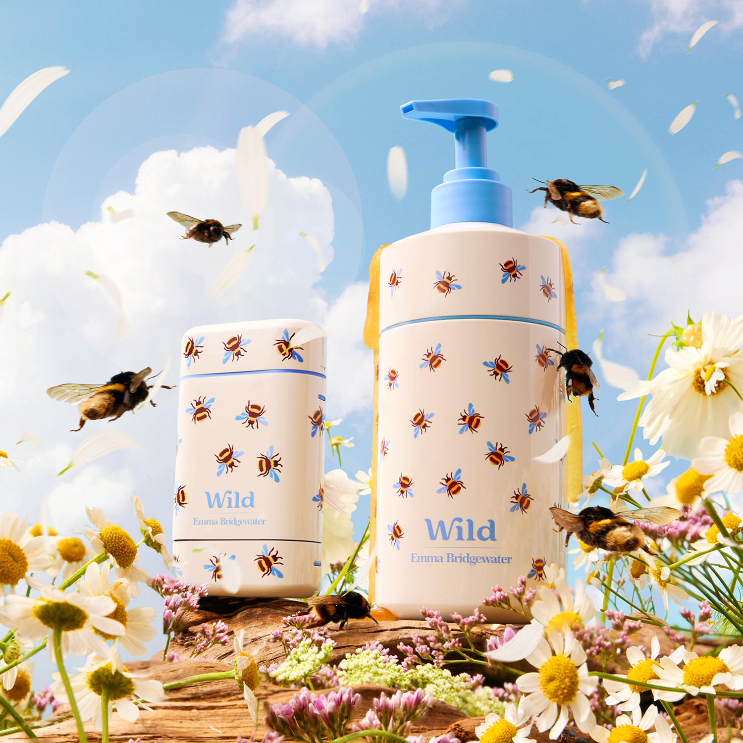 Caption: a couple of bottles sitting on top of a field of flowers