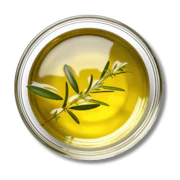 Caption: a bowl of olive oil with a sprig of olive