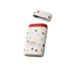 Caption: a white and red container with a polka dot design