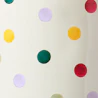 Caption: a white vase with multicolored polka dots on it