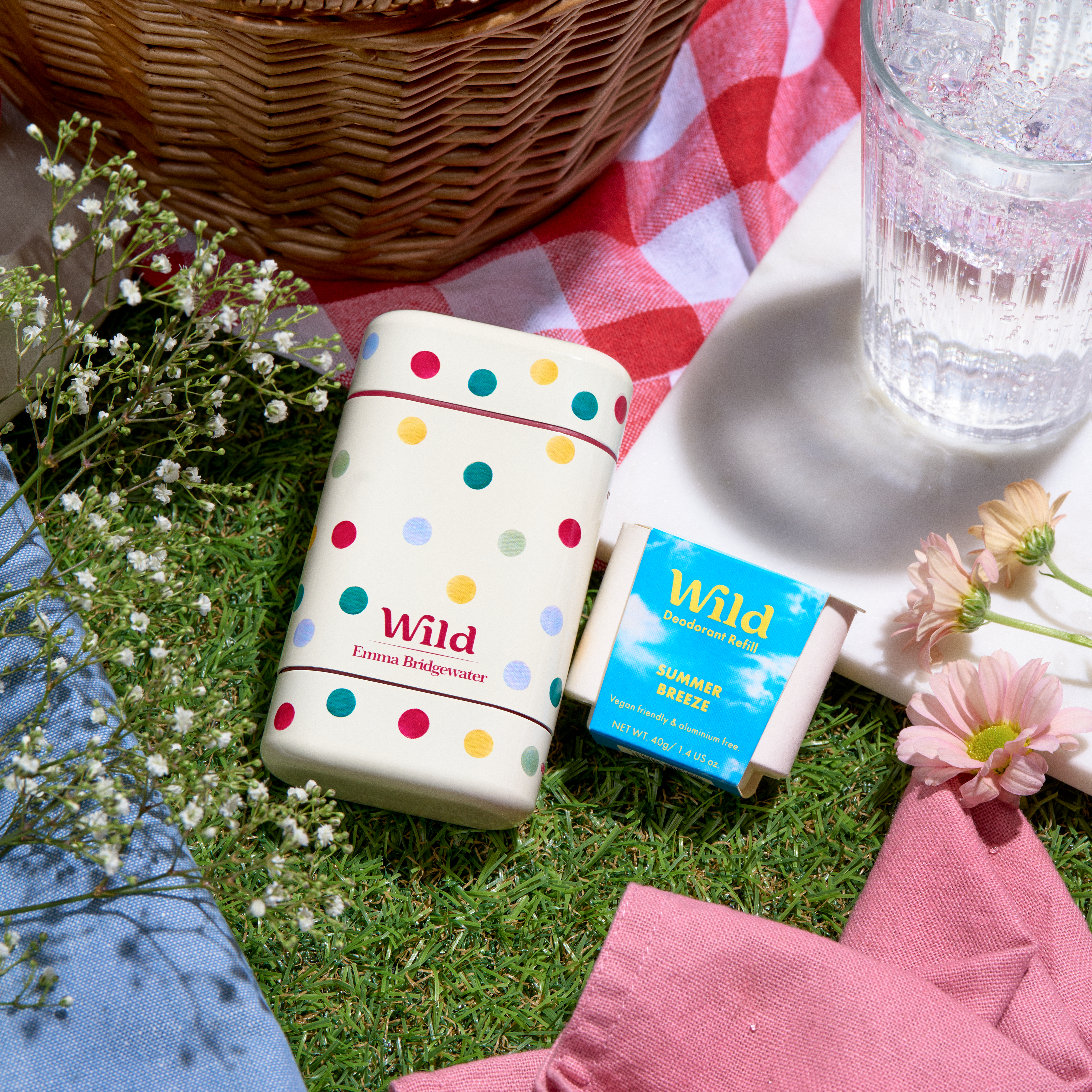 Caption: a couple of lighters sitting on top of a grass covered field