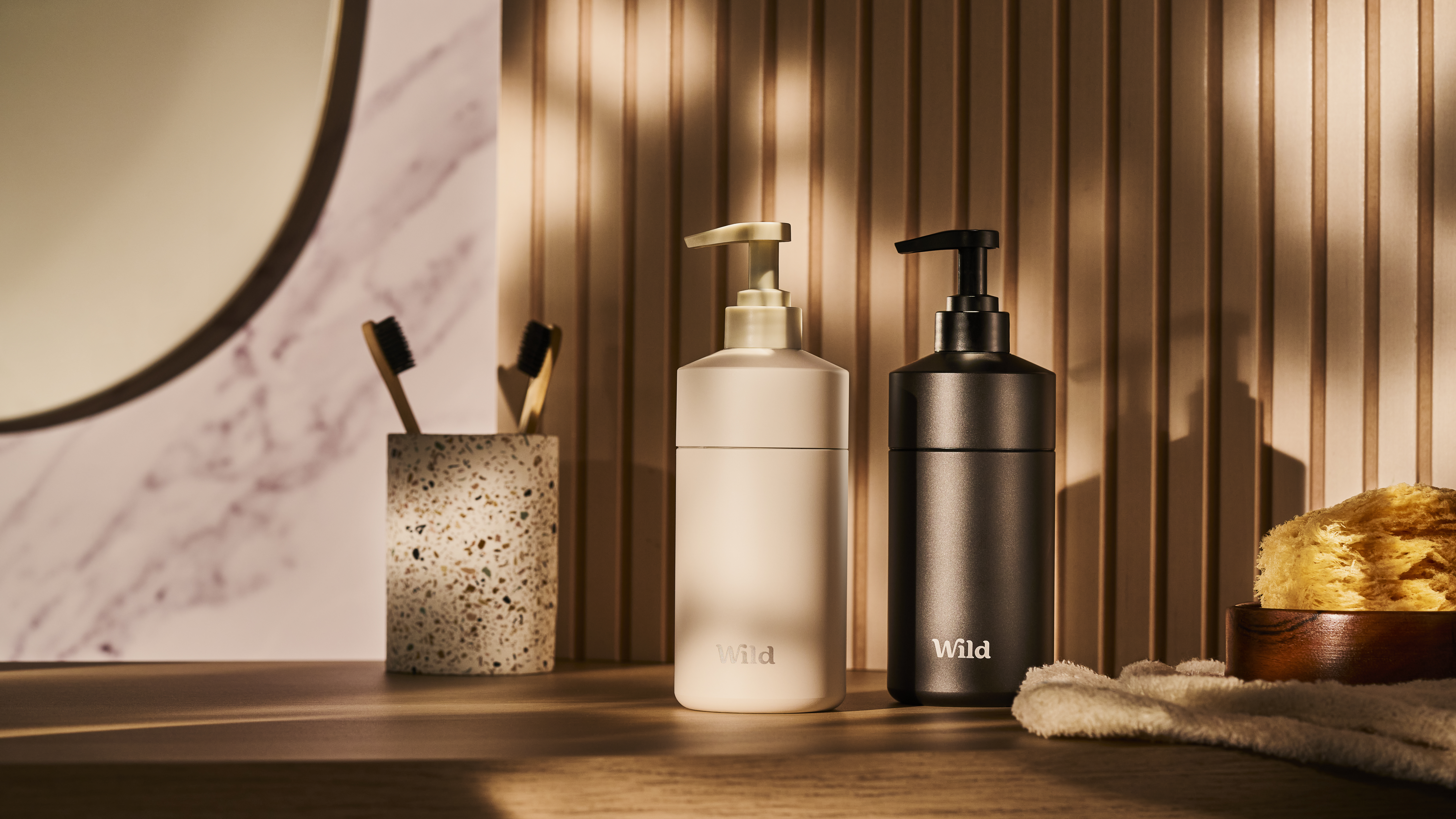 Caption: a counter with a soap dispenser, soap dispenser,