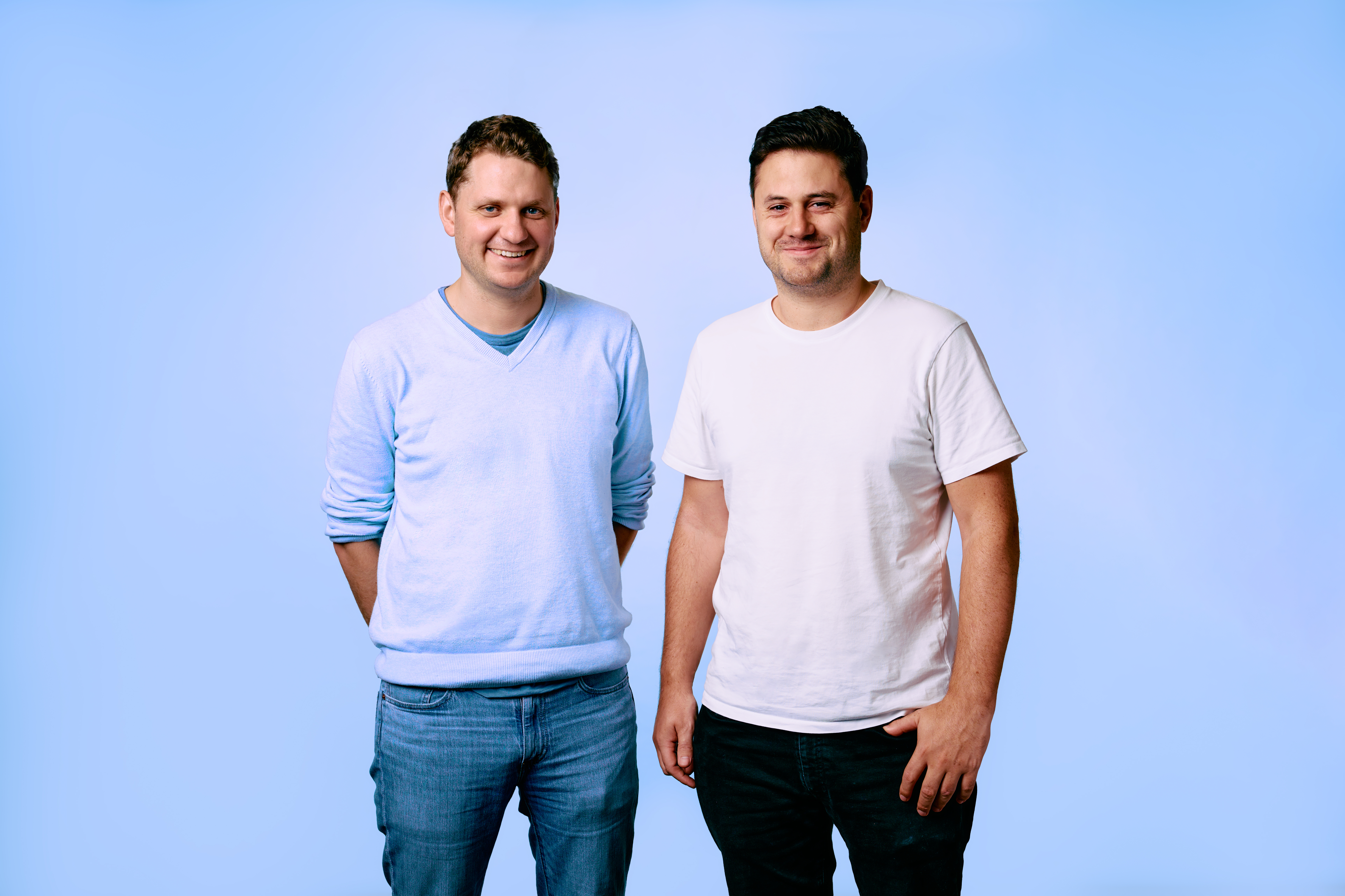 Caption: a couple of men standing next to each other