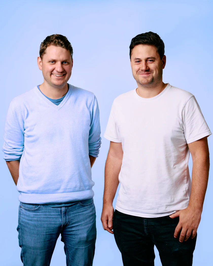 Caption: a couple of men standing next to each other