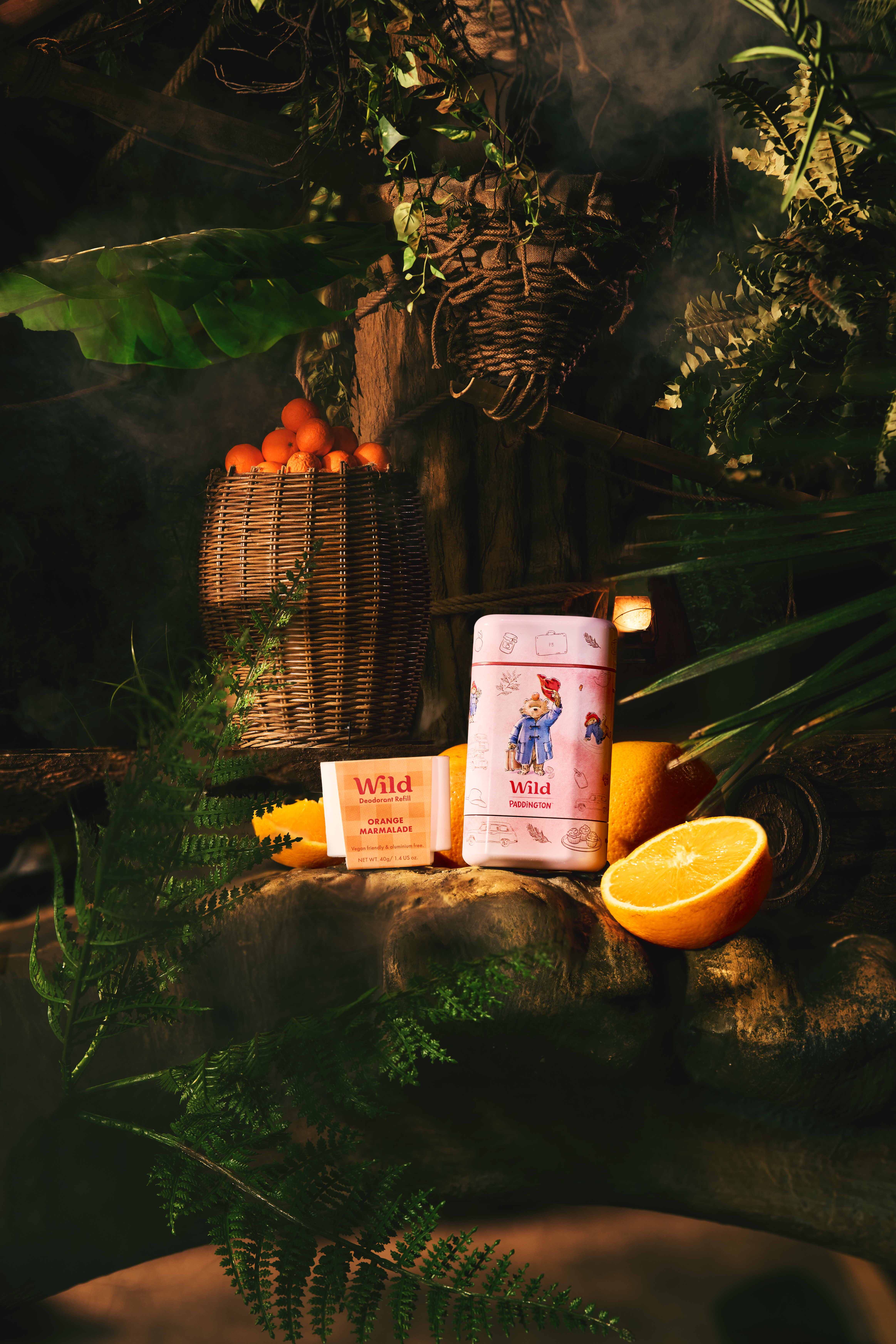 Caption: a bag of orange juice next to a basket of oranges