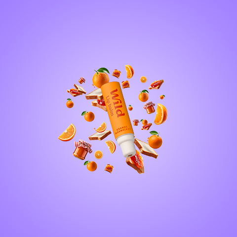 Caption: a tube of vitamin water surrounded by oranges