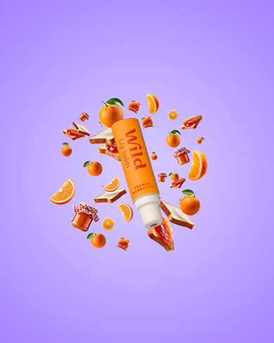 Caption: a tube of vitamin water surrounded by oranges