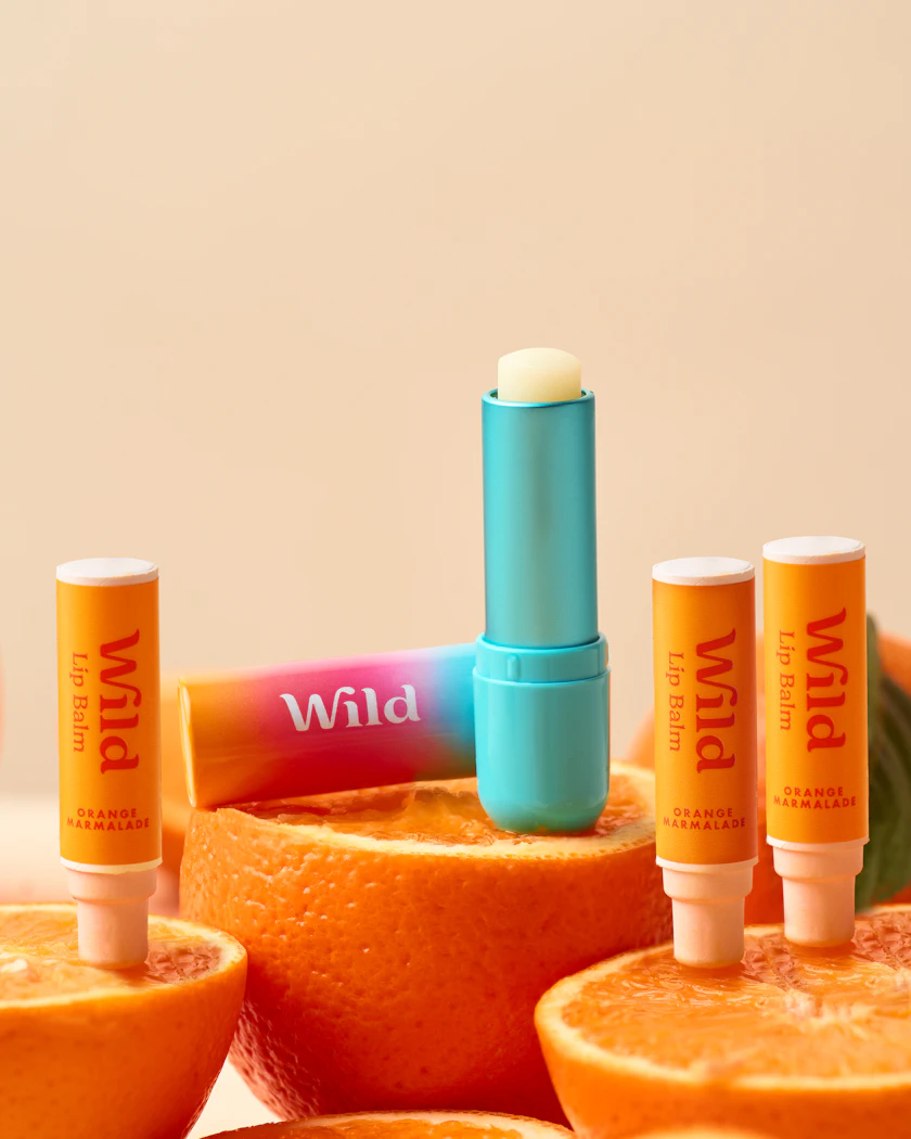 Caption: a group of oranges with lip bales on them