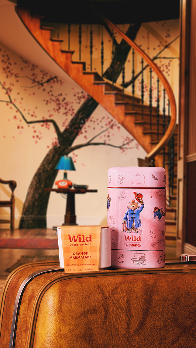 Caption: a brown suitcase sitting on top of a wooden floor