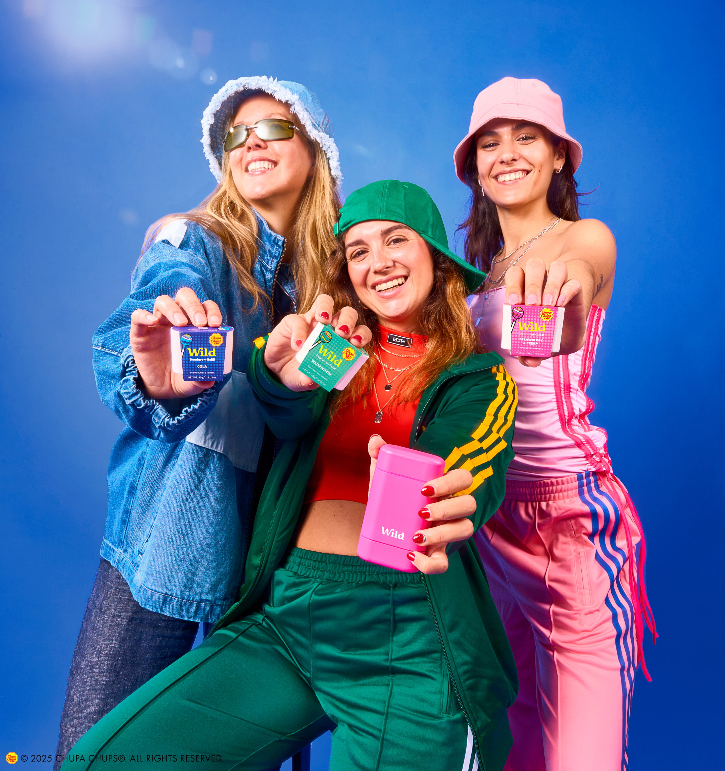 Caption: a group of three women standing next to each other