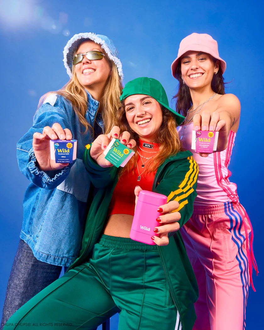 Caption: a group of three women standing next to each other