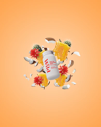 Caption: a bottle of protein drink surrounded by broken pieces of paper