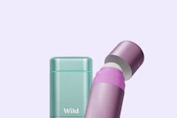 Caption: a pink and green tube next to a green container